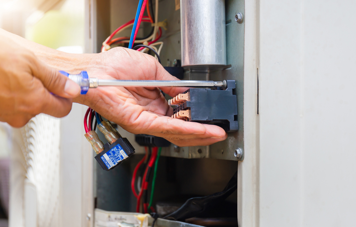 Close Up Of Air Conditioning Repair, Repairman Installing Magnet Close Up Of Air Conditioning Repair, Repairman Installing Magnet