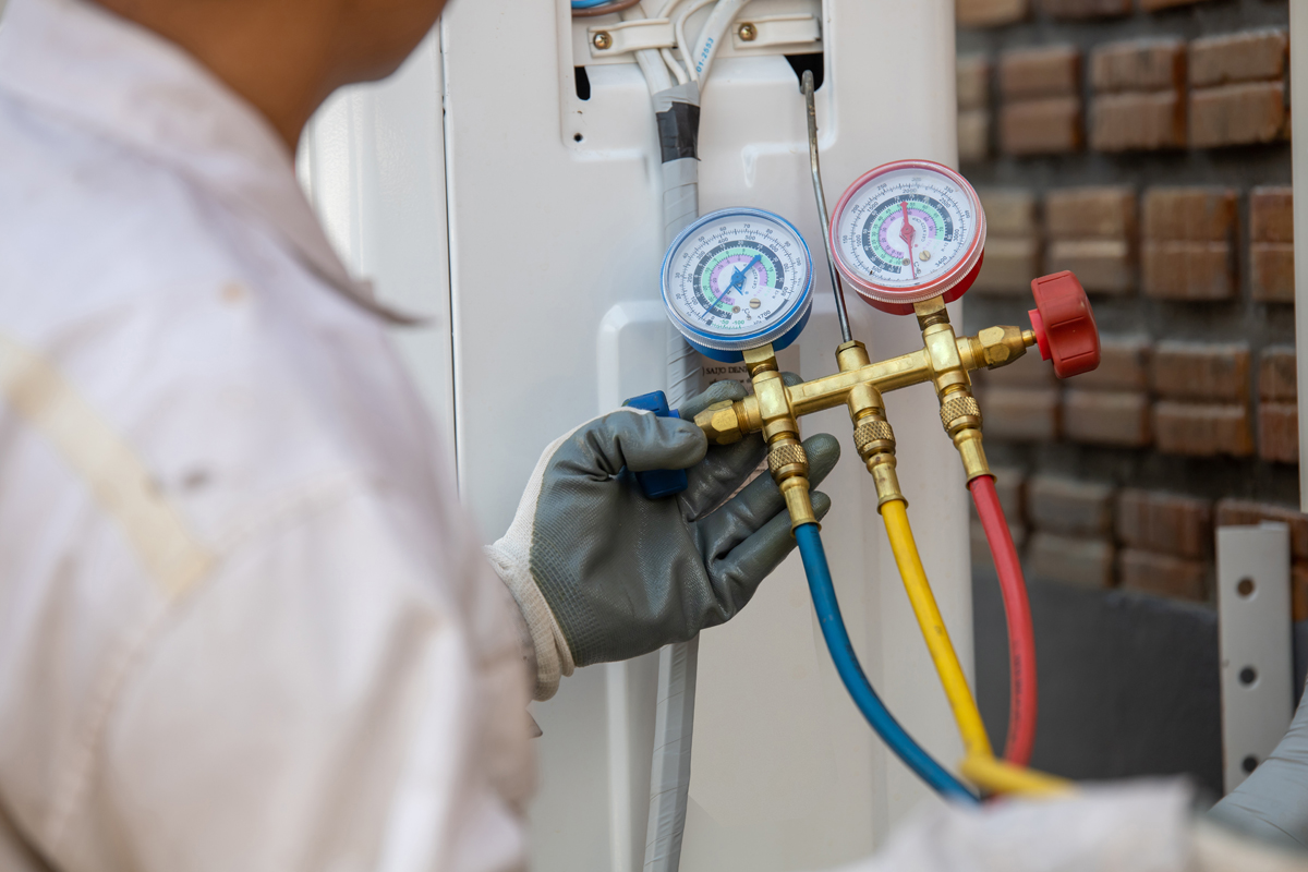 Air Conditioning Technician And A Part Of Preparing To Install N Air Conditioning Technician And A Part Of Preparing To Install N