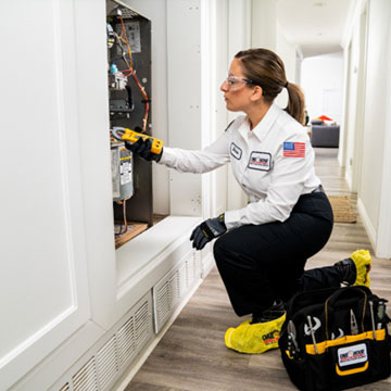 Woman Fixing Heating